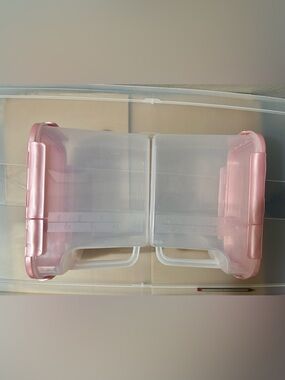 Two pink plastic containers